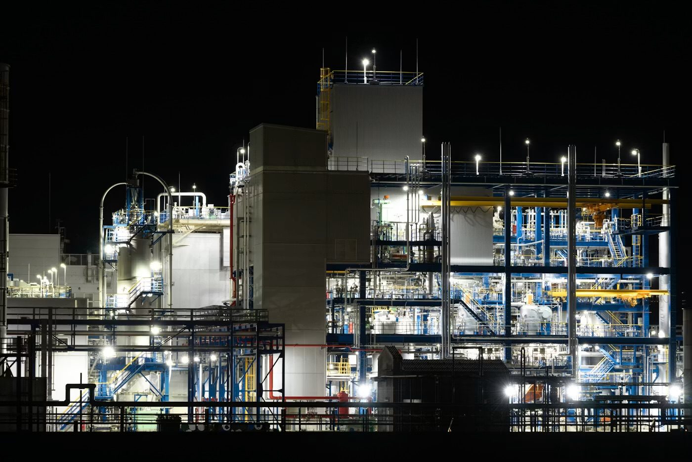 An industrial plant lit at night